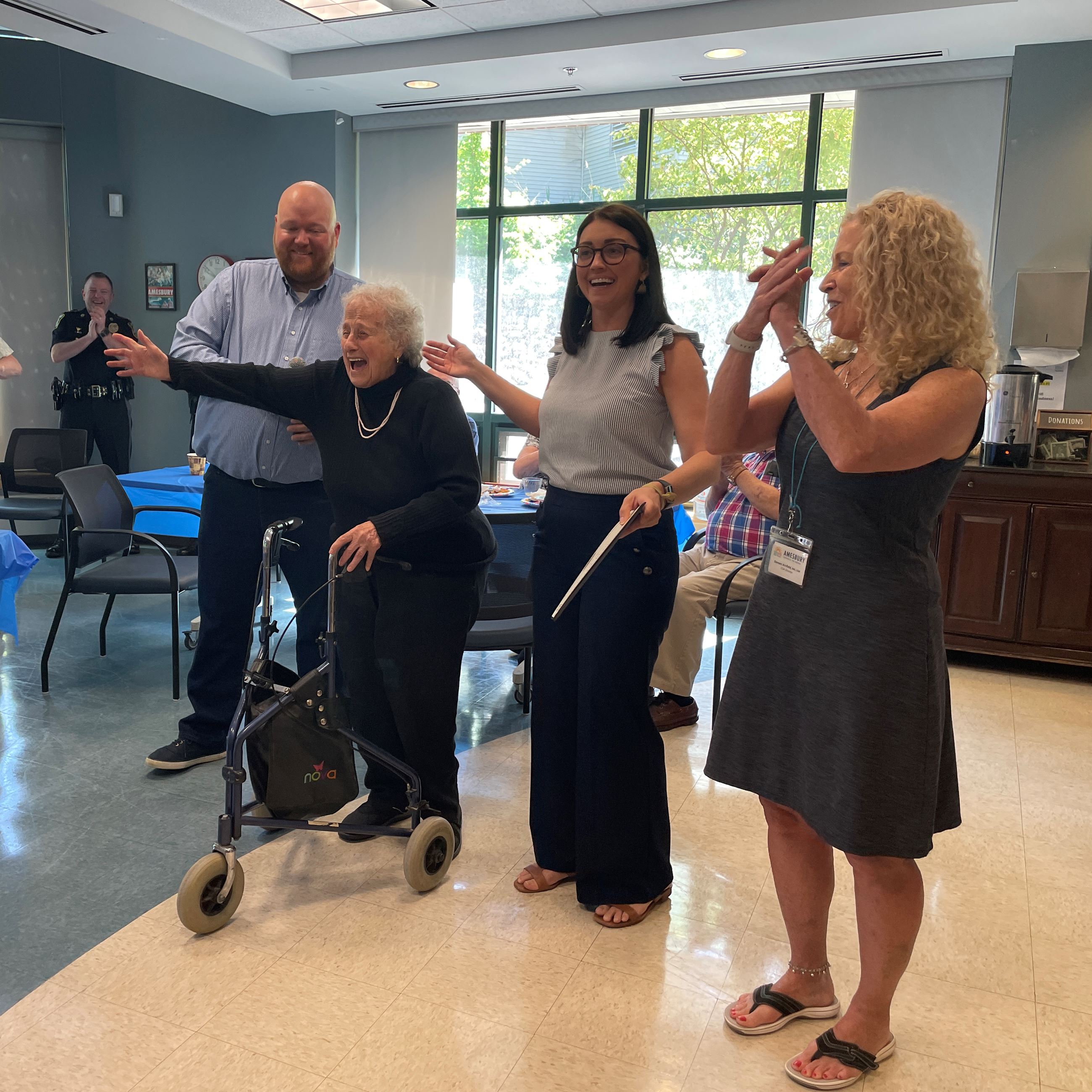 Nick Wheeler, Emily Zarraga, Mayor Gove, and Doreen Arnfield standing in front of the crowd. 